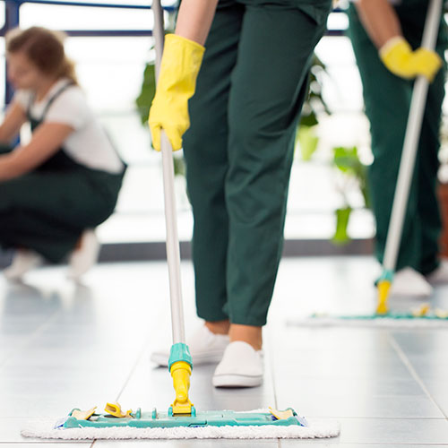 Cleaning crew mopping the floors of a commercial space